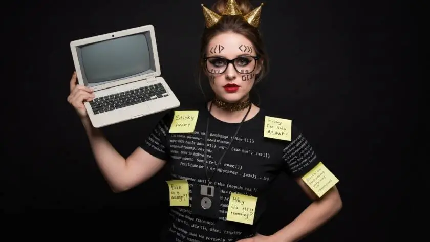 A vibrant Halloween party scene featuring a person dressed in a unique "Legacy Code" costume.